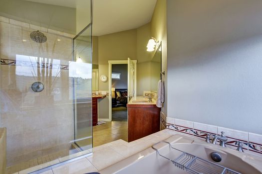 New bright and large bathroom with tile floor conected to master bedroom.