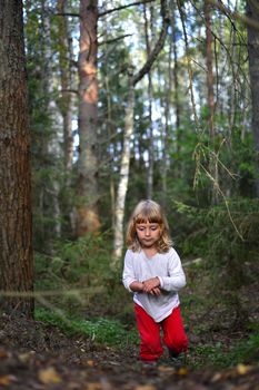 Smiling Happy little girl running on the summer forest  