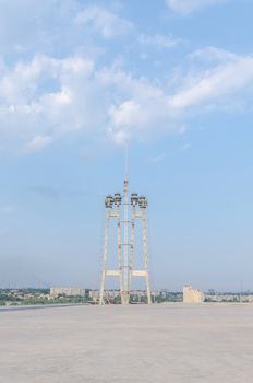 the construction of a bridge across the river with the supports, structural elements, cranes