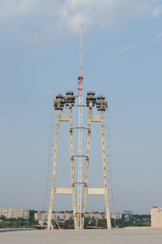 the construction of a bridge across the river with the supports, structural elements, cranes