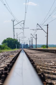 the railroad went off on the bridge against the sky