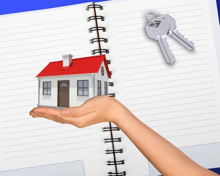 Humans hand holding house with keys and open notebook