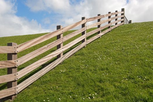 Wooden fence on a dyke
