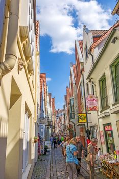 Bremen, Germany - June 6, 2014: Alley of the quarter Schnoor, an old town street in downtown Bremen, UNESCO World Heritage Site.