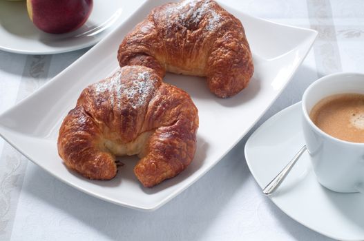 Continental breakfast with coffee , croissants and fresh fruit