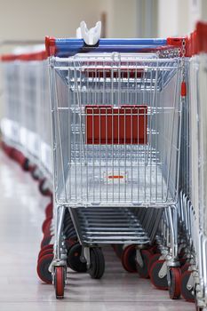 Close-up View of a Row of Stacked Supermarket Trolleys