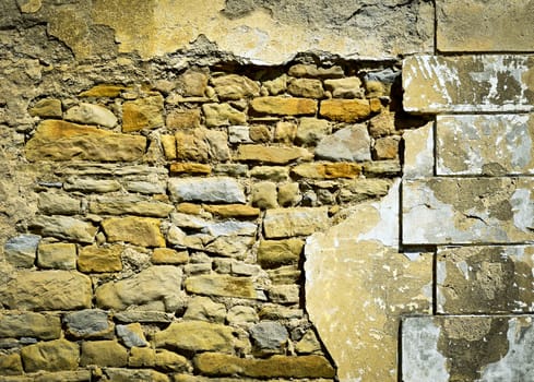 abstract background or texture Old stone wall with damaged plaster