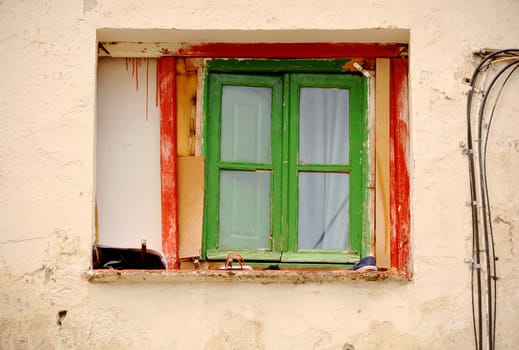 Window on facade of old house in Madrid