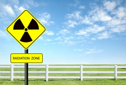 nuclear radiation warning symbol with blue sky 