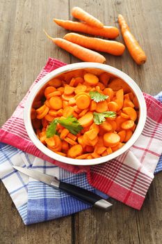 chopped carrots in bowl of steel , shallow dof 