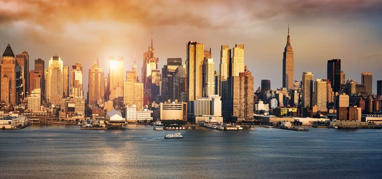 New York City skyline with urban skyscrapers at sunset, USA.