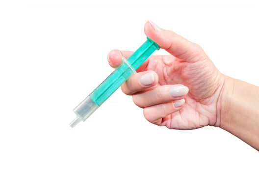 Woman's hand holding a syringe on isolated white,
