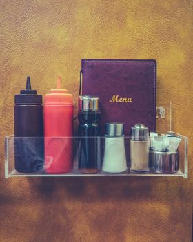 Retro Hipster Diner Or Dafe Menu And Condiments Against Faux Leather Backdrop
