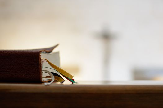 Bible with a cross in the chapel of focus