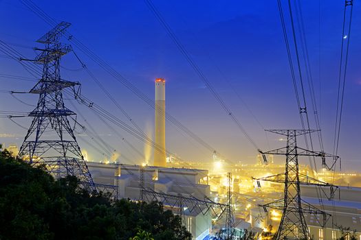 Power station with smoke at night