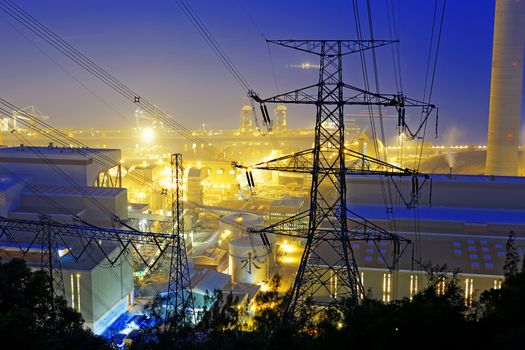 Power station with smoke at night