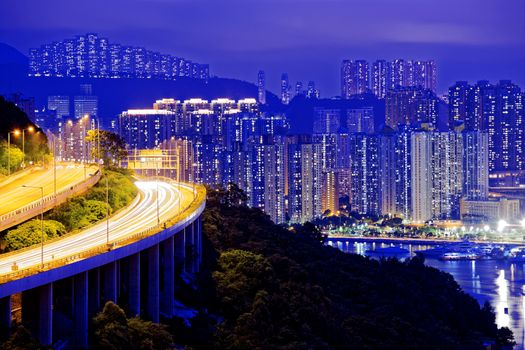 highway traffic road to city downtown at night, hong kong city