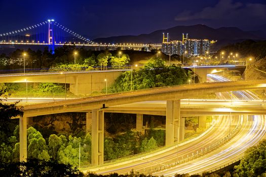 Highway traffic road and tsing ma bridge at night
