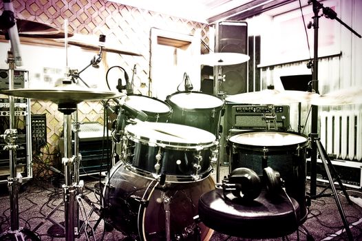 Drums conceptual image. Picture of drums in the recording studio. Retro vintage instagram picture.