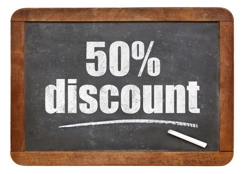 fifty percent discount sign - white chalk text on an isolated  vintage slate blackboard