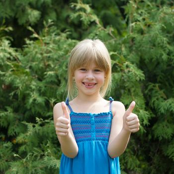 Cute little girl in the park on a sunny day