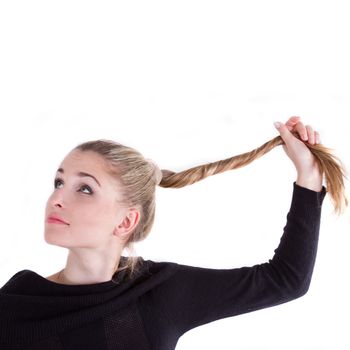 Portert girl with long blond braid on a white background