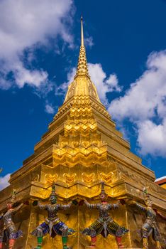 Demon warriors guarding the golden temple dome at Grand Palace of Bangkok.