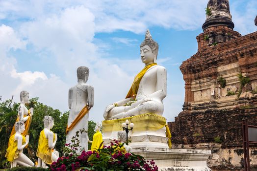 Statue of Lord Buddha preaching his disciples at Wat Yai Chaimongkon in Ayuthaya, Thailand.
