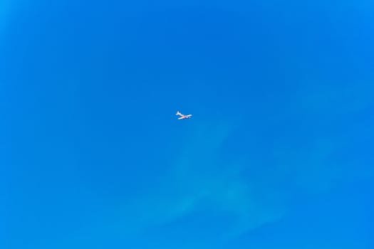 Photo of flying military plane in blue sky