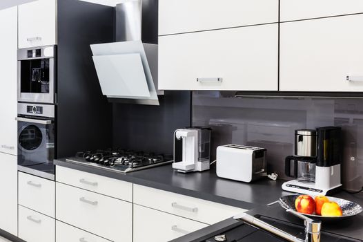 Modern luxury hi-tek black and white kitchen interior, clean design