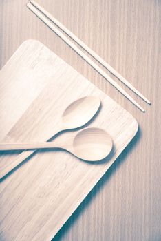 wood spoon with cutting board on table background vintage style