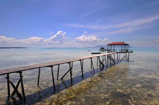 Wooden jetty headding towards the sea at Sabah National Park in Semporna Sabah, Borneo, Malaysia
