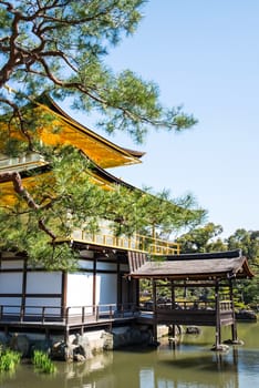 KYOTO, JAPAN - APRIL 14 2014: Old Japanese golden castle, Kinkakuji Temple (The Golden Pavilion)