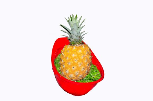 Red hard hat on a white background. In Helmgras is on a pineapple.