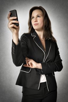 Image of business woman holding smartphone