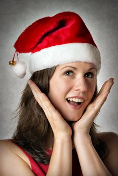 Portrait of a smiling woman wearing Santa Claus costume