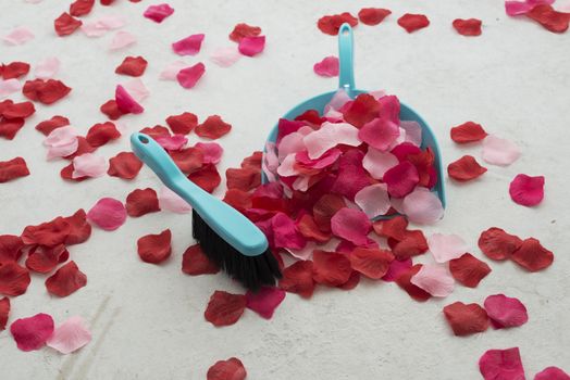 cleaning the floor from imitation red rose petals as end of marriage proposal