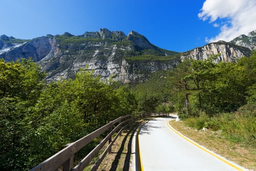 Bicycle path in the Sarca Valley (Valle del Sarca) through the forest. Trentino Alto Adige, Italy, Europe