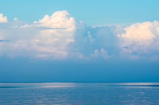 Panoramic view of surface of the ocean and blue sky