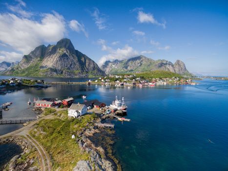 Breathtaking aerial view of scenic town Reine and surrounding fjords on Lofoten islands in Norway, famous tourist destination