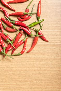 red chili peppers on wood table background