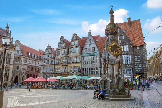 Bremen, Germany - June 6, 2014: View of Bremen old town with famous Roland statue. The town forms part of the German landmark fairy tale route and is a UNESCO world heritage.