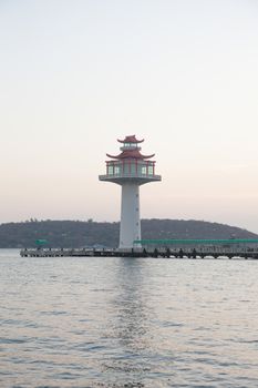 Lighthouse tower. Pier compared coast of the island. In the morning