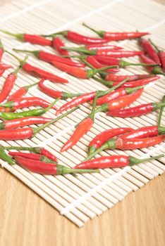 red chili peppers on wood table background