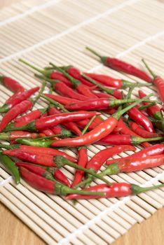 red chili peppers on wood table background