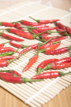 red chili peppers on wood table background