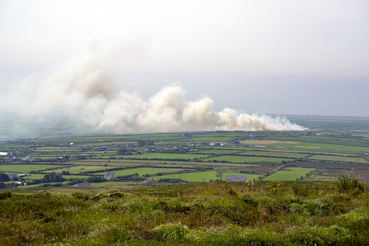 fields on fire in the countryside of kerry ireland