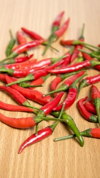 red chili peppers on wood table background