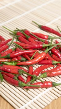 red chili peppers on wood table background