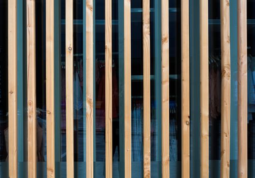 Vertical wooden fin facade of modern building